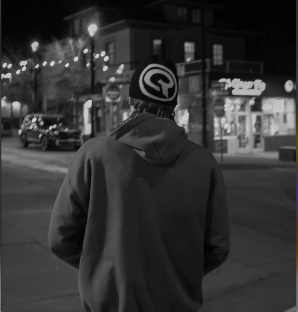 Cresta beanie portrait against brick wall